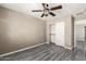 Comfortable bedroom featuring a ceiling fan, closet with slider doors and window overlooking the community outdoors at 4277 N 180Th Ln, Goodyear, AZ 85395