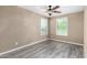 Bedroom with a ceiling fan and two windows at 4277 N 180Th Ln, Goodyear, AZ 85395