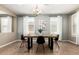 Formal dining room featuring tile flooring, modern black chairs and minimalist decor at 4277 N 180Th Ln, Goodyear, AZ 85395