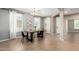 The dining area has modern table and chairs and three windows, filling the room with natural light at 4277 N 180Th Ln, Goodyear, AZ 85395