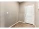 Entryway with tile flooring and a white front door at 4277 N 180Th Ln, Goodyear, AZ 85395