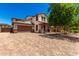 Charming two-story house with a paver driveway, a two-car garage, and a covered porch at 4277 N 180Th Ln, Goodyear, AZ 85395