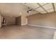 Spacious garage features a roll up door, a water heater, and room for your cars and hobbies at 4277 N 180Th Ln, Goodyear, AZ 85395