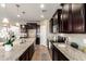 A well-equipped kitchen featuring stainless steel appliances and granite countertops at 4277 N 180Th Ln, Goodyear, AZ 85395