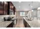 A well-equipped kitchen featuring stainless steel appliances and granite countertops at 4277 N 180Th Ln, Goodyear, AZ 85395