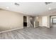 Living Room with gray wood floors, staircase, and cabinetry at 4277 N 180Th Ln, Goodyear, AZ 85395