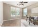 Office space features a ceiling fan, neutral paint, tile flooring, and two large windows for great light at 4277 N 180Th Ln, Goodyear, AZ 85395