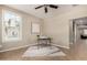 Well lit room perfect for an office space, boasting tile flooring and a large window at 4277 N 180Th Ln, Goodyear, AZ 85395