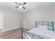 Bedroom boasts wood-look floors and a ceiling fan at 44853 W Jack Rabbit Trl, Maricopa, AZ 85139