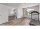 Bonus room area with wood flooring, natural light, and convenient access to the backyard at 44853 W Jack Rabbit Trl, Maricopa, AZ 85139