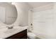 Clean bathroom with a vanity, a large mirror, and a bathtub/shower combination at 4526 W Mission Ln, Glendale, AZ 85302