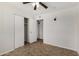 Bedroom featuring tile flooring, ceiling fan, and a closet at 4526 W Mission Ln, Glendale, AZ 85302