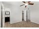 This bedroom features neutral paint, tile flooring, ceiling fan and a closet at 4526 W Mission Ln, Glendale, AZ 85302