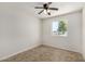 Bedroom featuring tile flooring, ceiling fan, and a window with natural light at 4526 W Mission Ln, Glendale, AZ 85302
