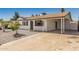 Well-kept home featuring a spacious covered carport and minimal landscaping at 4526 W Mission Ln, Glendale, AZ 85302