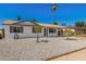 Inviting single-Gathering home featuring a low-maintenance gravel yard and covered carport at 4526 W Mission Ln, Glendale, AZ 85302