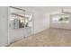 Spacious living area with tile flooring, a ceiling fan, and sliding door access to the outdoors at 4526 W Mission Ln, Glendale, AZ 85302