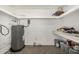 Storage area featuring water heater, shelving and paint at 4526 W Mission Ln, Glendale, AZ 85302