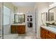 Bathroom featuring double vanity, and glass-enclosed shower, providing a spa-like experience at 4528 E Donato Dr, Gilbert, AZ 85298
