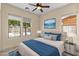 Cozy bedroom featuring plush bedding, coordinated decor, and natural light, enhancing its charm at 4528 E Donato Dr, Gilbert, AZ 85298