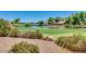 Scenic golf course community features a beautiful pond and lush green fairways at 4528 E Donato Dr, Gilbert, AZ 85298