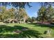 Park with horseshoe pits, a gazebo, mature trees, and green space for outdoor enjoyment at 4528 E Donato Dr, Gilbert, AZ 85298