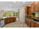 Bright kitchen with a breakfast bar and open access to the living and dining areas at 4528 E Donato Dr, Gilbert, AZ 85298