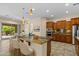 Spacious kitchen with a large island, granite countertops, and stainless steel appliances at 4528 E Donato Dr, Gilbert, AZ 85298