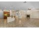 Spacious living room with tiled floors, a fireplace, and an open-concept layout to the kitchen at 4528 E Donato Dr, Gilbert, AZ 85298