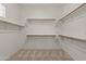 Walk-in closet featuring built-in shelving and rod system to maximize storage space at 4528 E Donato Dr, Gilbert, AZ 85298