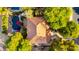 Stunning aerial view of a custom home with a red-tiled roof and a backyard pool at 5139 S Marble St, Gilbert, AZ 85298