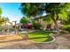 Expansive backyard with well-manicured lawn, pool area, and patio seating, perfect for outdoor entertaining at 5139 S Marble St, Gilbert, AZ 85298