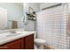 This updated bathroom features warm accents, a shower, and vanity at 5139 S Marble St, Gilbert, AZ 85298