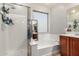 This bathroom features a bathtub, walk-in shower, and double sink at 5139 S Marble St, Gilbert, AZ 85298
