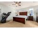 This bedroom features a ceiling fan and an exercise machine; a comfortable space for rest and relaxation at 5139 S Marble St, Gilbert, AZ 85298