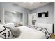 Neutral bedroom with queen bed, black-out curtains, and convenient closet with mirrored doors at 5139 S Marble St, Gilbert, AZ 85298