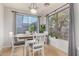Bright dining room with large windows and a charming white wood dining set at 5139 S Marble St, Gilbert, AZ 85298