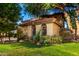 Charming home with tile roof, arched windows, lush green lawn and mature trees at 5139 S Marble St, Gilbert, AZ 85298
