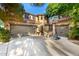 Charming home featuring a tile roof, two-car garage, mature trees, and a basketball hoop on a sunny day at 5139 S Marble St, Gilbert, AZ 85298