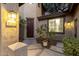 Inviting front entrance featuring a stylish light fixture and beautiful potted plants at 5139 S Marble St, Gilbert, AZ 85298