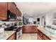 Well-equipped kitchen with stainless steel appliances, granite countertops, and seamless open floor plan at 5139 S Marble St, Gilbert, AZ 85298