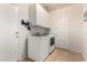 Laundry room with washer and dryer and adjacent cabinet at 5139 S Marble St, Gilbert, AZ 85298