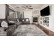 Cozy living room with a plush sectional sofa, area rug, fireplace, and sliding doors to the outside at 5139 S Marble St, Gilbert, AZ 85298