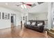 Upstairs loft area with rich hardwood floors and a comfortable brown leather couch at 5139 S Marble St, Gilbert, AZ 85298