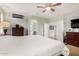 This main bedroom features carpet, neutral paint and access to a luxurious bathroom at 5139 S Marble St, Gilbert, AZ 85298