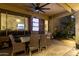 Comfortable outdoor patio featuring a dining set and media, perfect for entertaining at 5139 S Marble St, Gilbert, AZ 85298