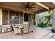 Relaxing outdoor patio with dining set, ceiling fan, and built-in cooking setup at 5139 S Marble St, Gilbert, AZ 85298