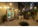 Cozy patio featuring brick pavers, string lights, lush greenery, and outdoor access at 5139 S Marble St, Gilbert, AZ 85298