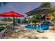 Resort-style backyard with a sparkling pool, lounge chairs, and lush landscaping at 5139 S Marble St, Gilbert, AZ 85298