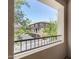 Exterior view looking out from balcony with metal railing at nearby building and parking at 5550 N 16Th St # 166, Phoenix, AZ 85016